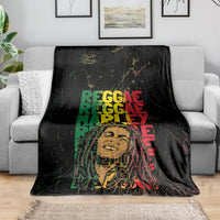 Black reggae blanket on a couch, bold green and red stacked typography graphic
