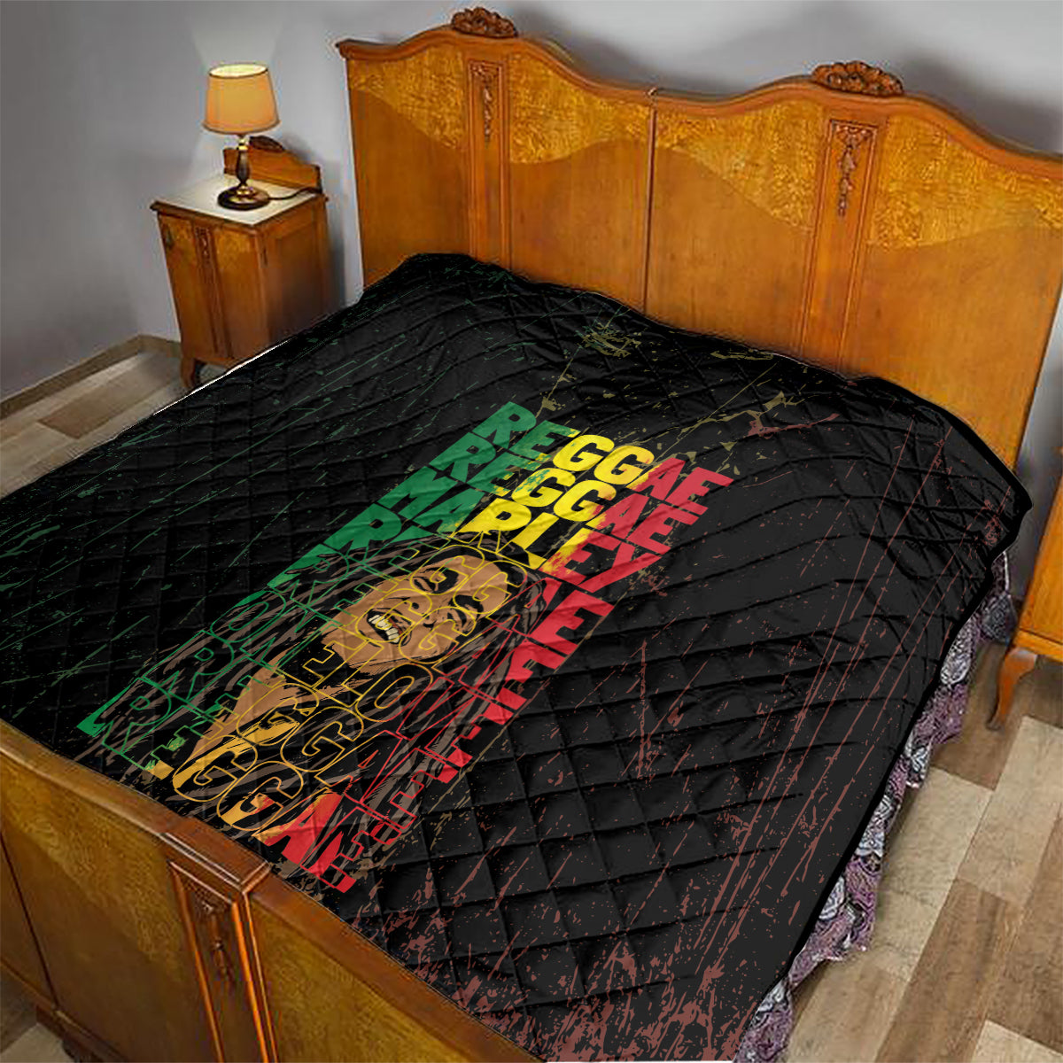 Black quilt on bed with diamond stitching and multicolor REGGAE text over a portrait