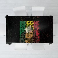 Black tablecloth with stacked reggae-style text and distressed grunge print.