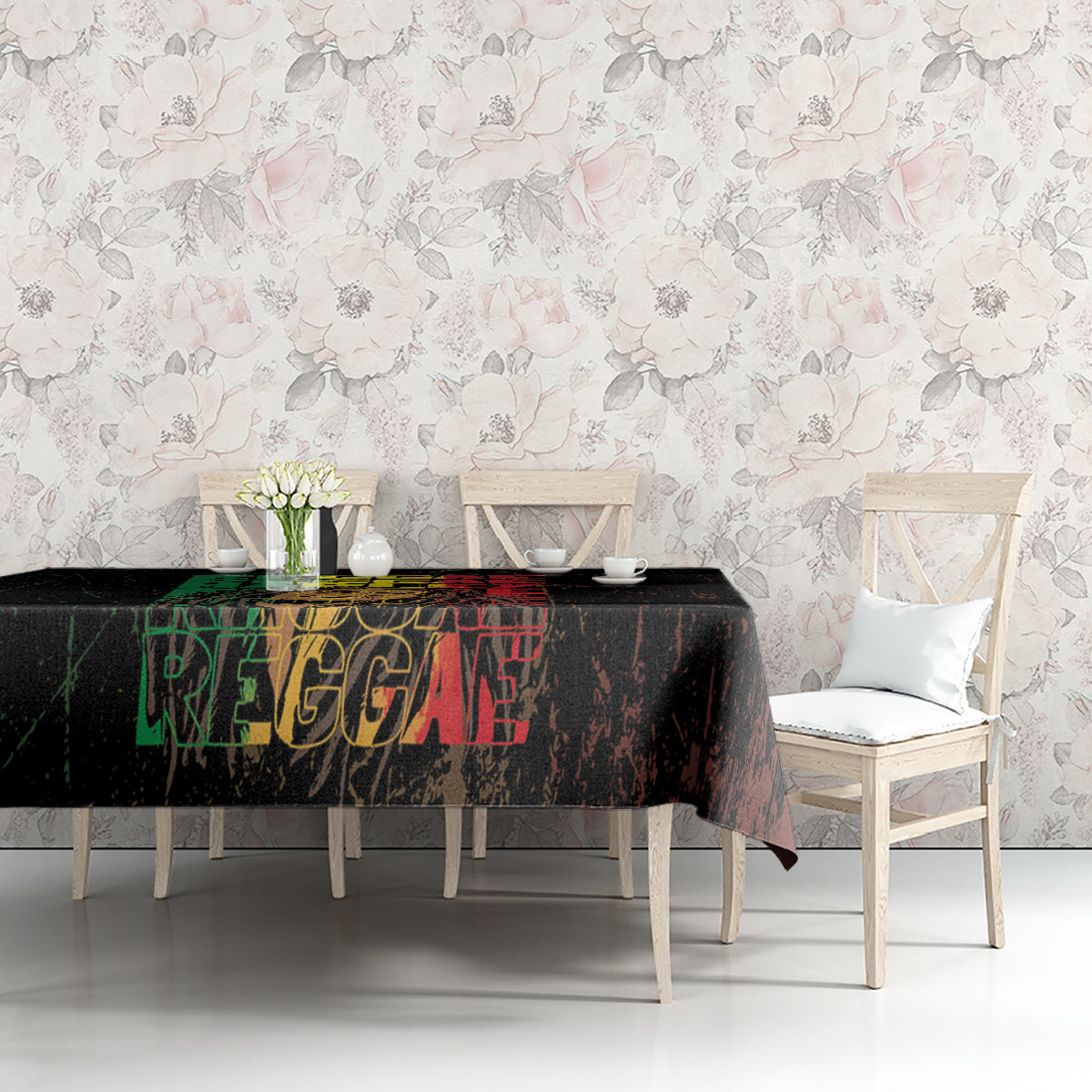Black tablecloth with reggae-style word art, styled on a dining table with chairs.