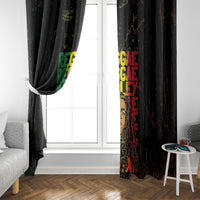 Black Marley window curtain with multicolor reggae grunge text, one panel partially pulled aside