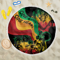 Round beach blanket with One Love One Heart reggae print and white fringe edge