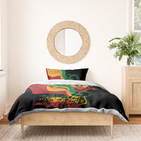 Black comforter set with two pillows featuring “One Love One Heart” reggae-style print