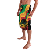 Knee-length swim shorts side view with black background and multicolor wave and palm print