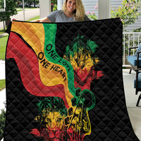 Black quilt with colorful reggae heart, lion and guitar graphic, quilted diamond pattern.