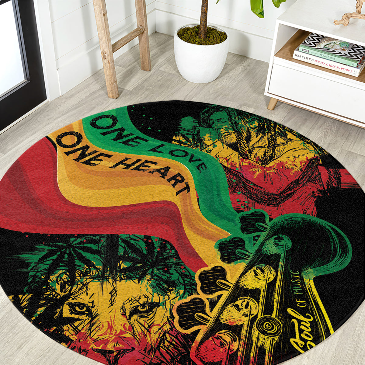 Round area rug with reggae-style artwork in red, green, yellow and One Love text