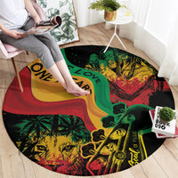 Round area rug with reggae-style faces and instruments in red, green, yellow and One Love