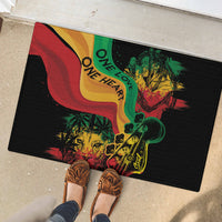 Black rubber doormat with reggae colors; 'ONE LOVE' and 'ONE HEART' graphic under shoes