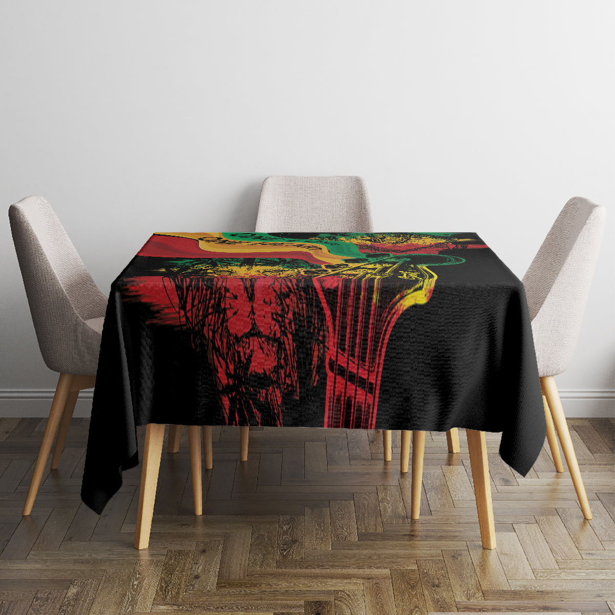 Black tablecloth with vibrant red, green, and yellow mural-style reggae print on tabletop