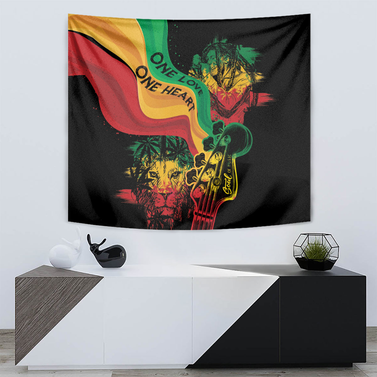 Black reggae tapestry showing One Love One Heart words and colorful flag wave with guitar figure