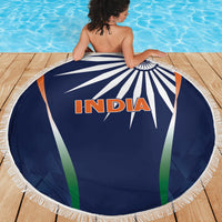 Blue circular India beach blanket with fringed border and starburst graphic
