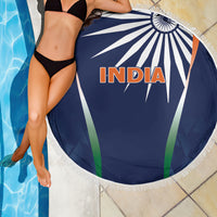 Blue round India beach blanket with 'INDIA' text, fringed edge, and sunburst lines