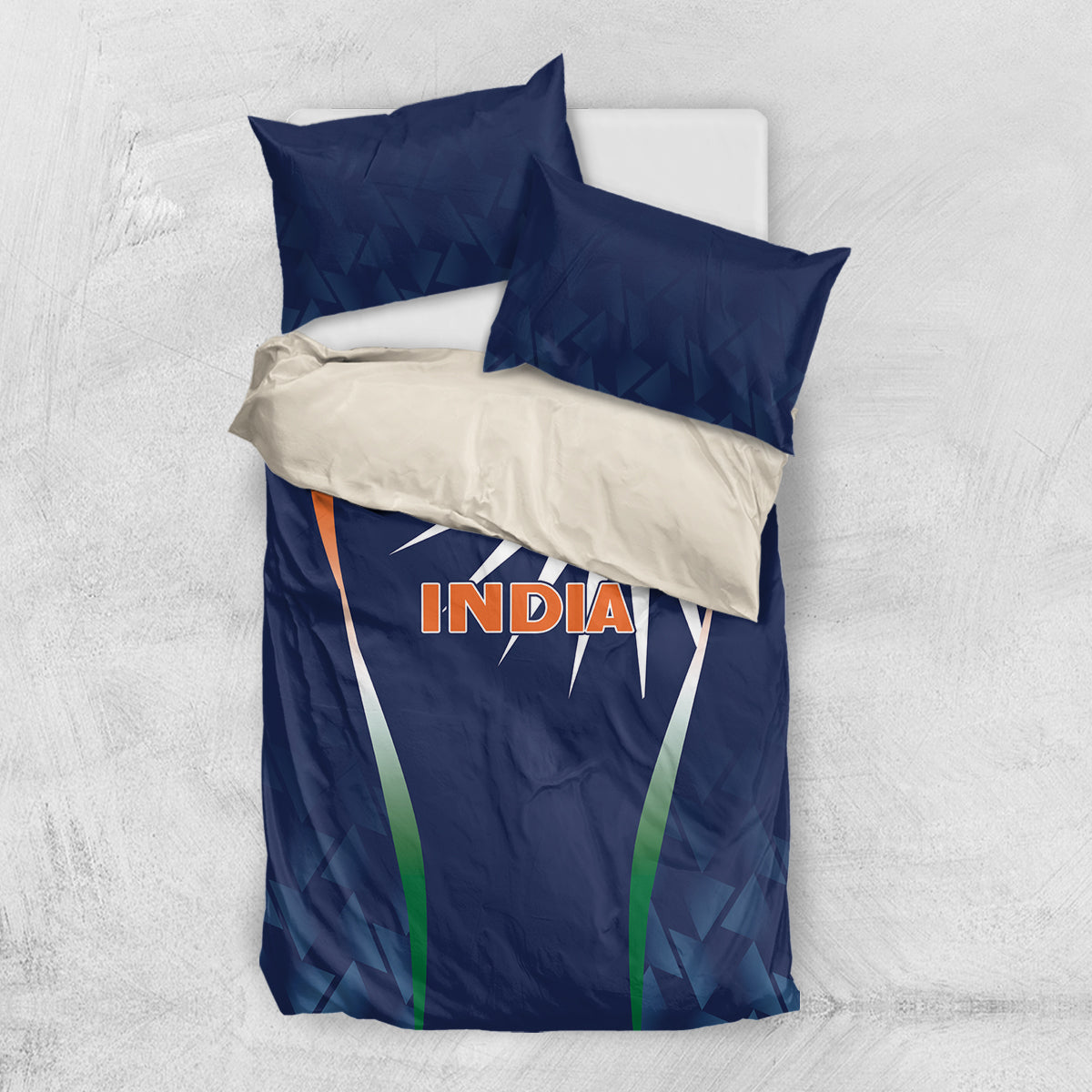 Blue India-themed bedding set shown from above: duvet with sunburst panel and two pillows