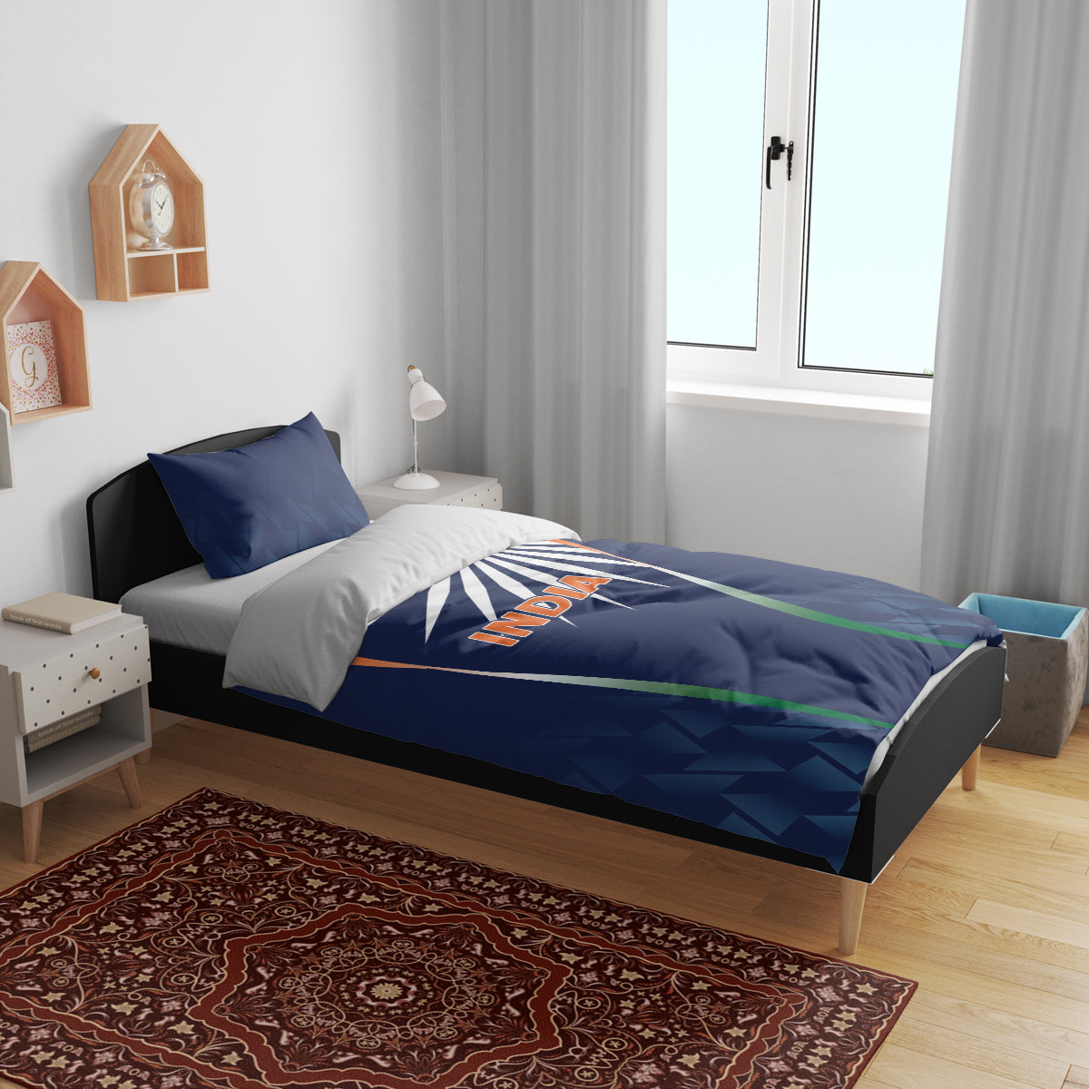 Blue India-themed bedding set on bed: duvet with sunburst and tricolor stripes, two pillows