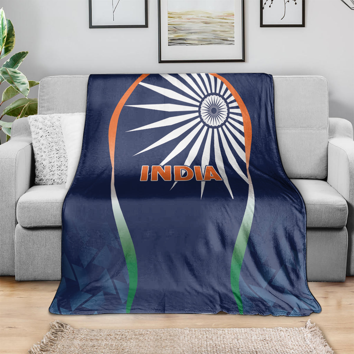 Blue India cricket blanket over gray sofa with white emblem and “India” logo