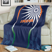 Blue India cricket blanket on armchair, featuring white emblem and orange “India”