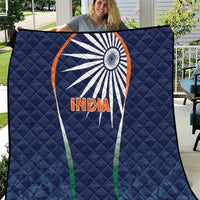 Blue India quilt blanket with large sunburst logo and INDIA text, front view
