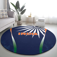 Round blue India rug with INDIA lettering and multicolor curved panel stripes