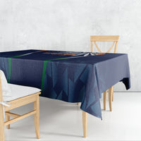 Blue rectangular tablecloth with deep navy geometric pattern and crest stripe accents