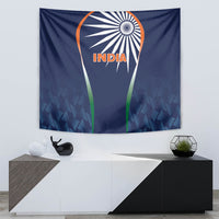 Blue INDIA cricket tapestry above console, with orange emblem and green vertical stripes