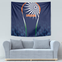 Blue INDIA cricket tapestry on wall above sofa, featuring emblem with green accents