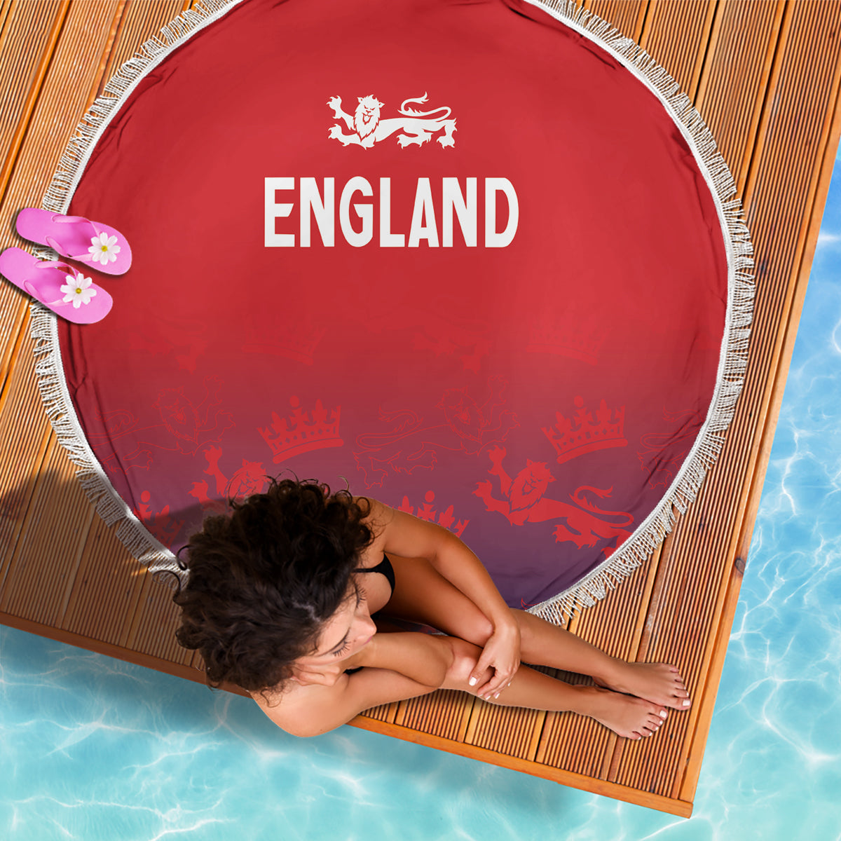 Red circular beach blanket with fringe trim, 'ENGLAND' text and lion/crown graphic