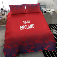 Red England duvet cover and pillowcases on bed, crowned lion print