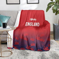 Red blanket with England text and lion crest, scattered crown and lion pattern