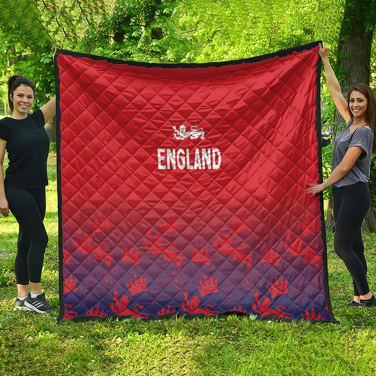 Red and navy England quilt blanket with crest logo and 'ENGLAND' on outdoor grass.