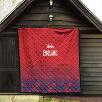 Red and navy England quilt with diamond quilting and crest logo, stitched border.