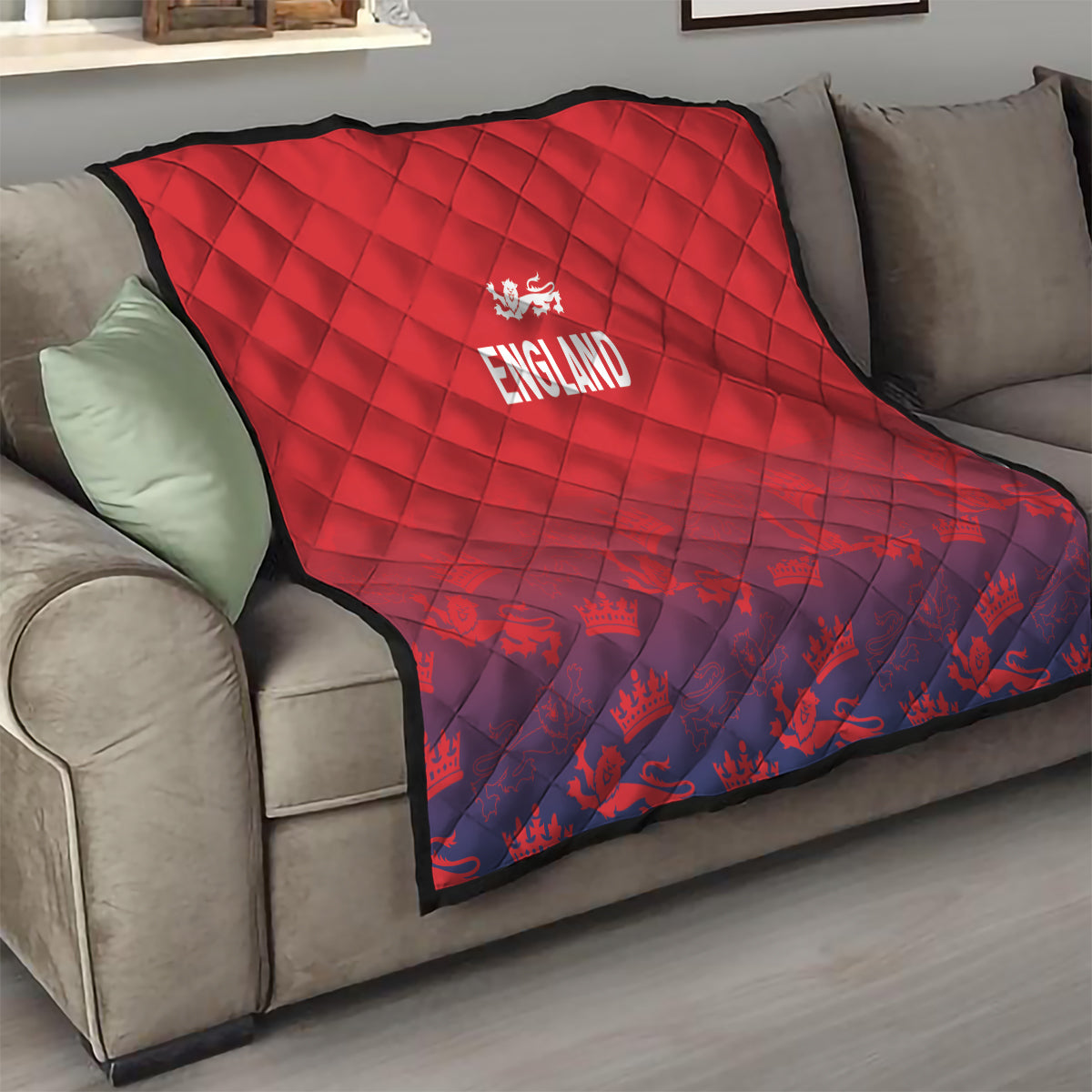 Red and navy England quilt on living-room sofa, diamond quilting and 'ENGLAND' emblem.