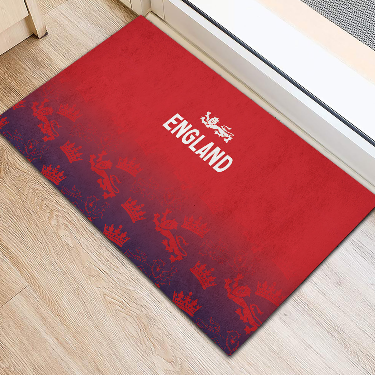 Red England doormat on floor, crown pattern and centered white England emblem