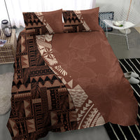 Brown duvet and pillow shams with tribal blocks, aztec-style patterns, and light motif trim