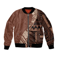 Brown bomber jacket with tribal print paneling, front zipper, and black ribbed cuffs