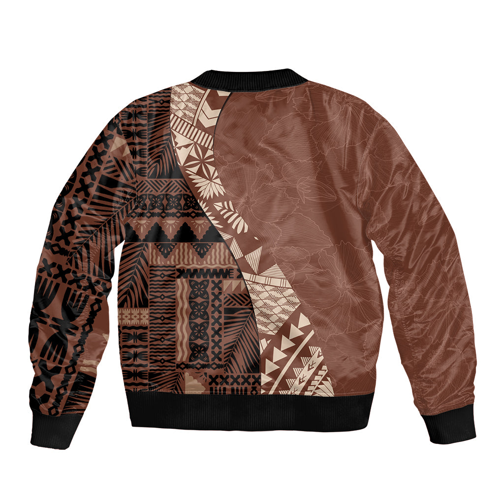 Brown bomber jacket with tribal pattern back panel, black ribbed hem and cuffs