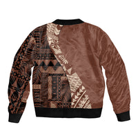 Brown bomber jacket with tribal pattern back panel, black ribbed hem and cuffs