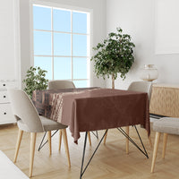 Brown patterned tablecloth on dining set with tribal panel print and solid center section