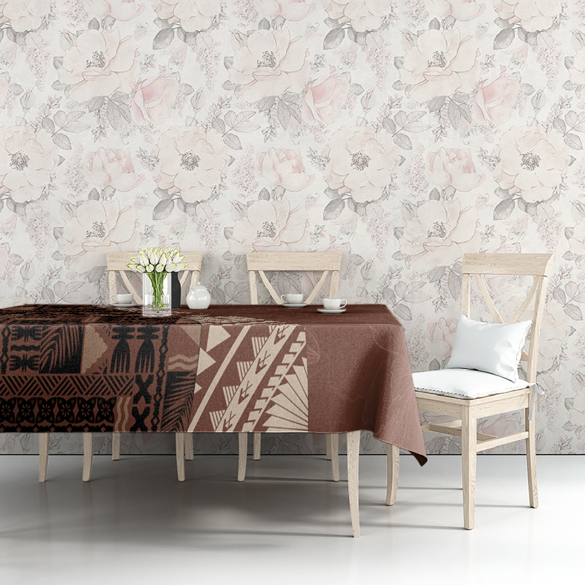 Brown tablecloth with tribal tapa patchwork and geometric stripe panel, draped on table
