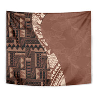 Brown tribal tapestry close-up showing geometric motifs and leaf-like texture on right.