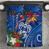 Blue bedding set with Guam turtle emblem, colorful flowers and tapa geometric patterns