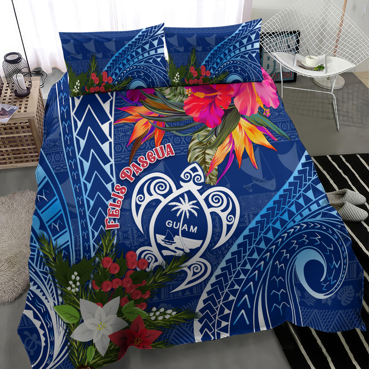 Blue bedding set and pillows with Guam turtle emblem, tropical flowers, and tapa designs