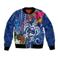 Blue bomber jacket with zip front and tropical floral graphic plus Guam emblem