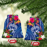 Pair of blue curved ceramic turtle ornaments with floral and gold hanging loops