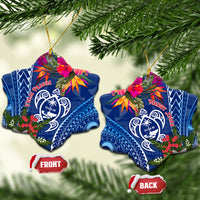 Pair of blue star-shaped ceramic turtle ornaments with floral accents and gold loops