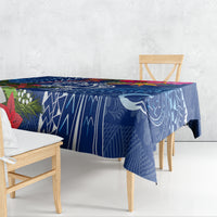 Blue Christmas tablecloth with geometric tapa pattern and turtle motifs on dining table