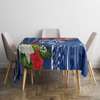 Blue Christmas tablecloth with turtle and geometric pattern with poinsettia accents