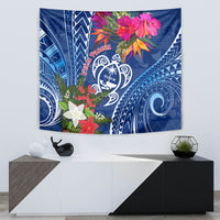 Blue rectangular tapestry with Guam turtle emblem, Pasqua lettering, and colorful flower crest.