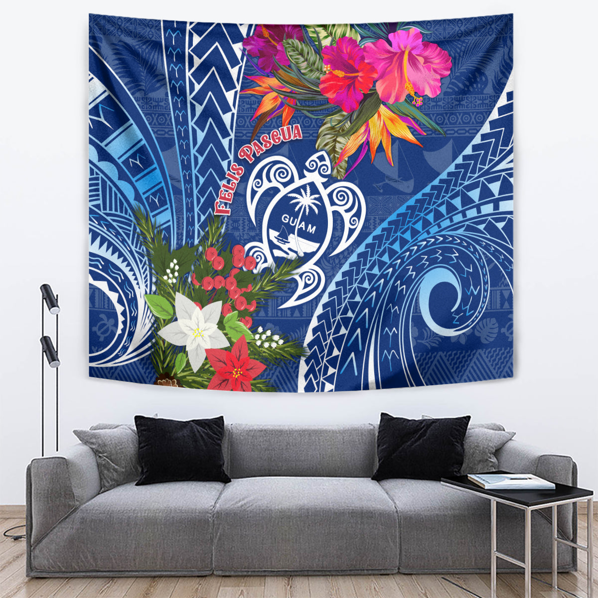 Blue tapestry with Guam turtle emblem, red Pasqua text, and pink floral accents.