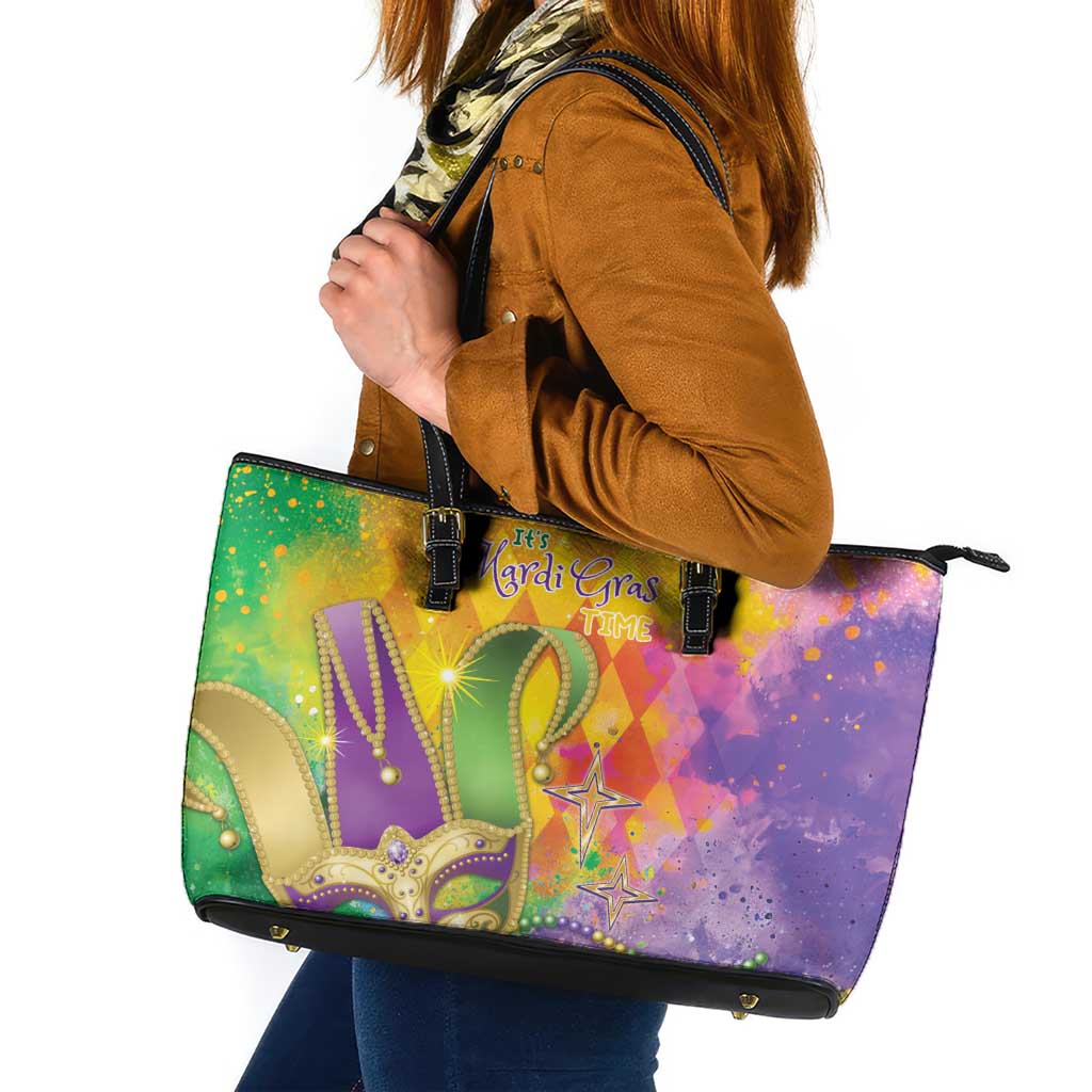Mardi Gras leather tote bag with watercolor purple-green design, black handles and zipper
