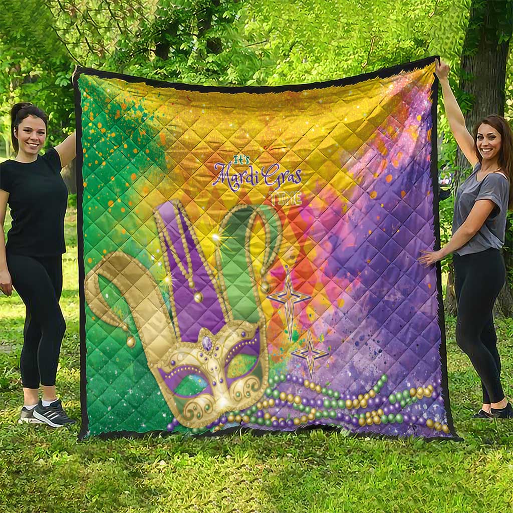 Large multicolor Mardi Gras-themed quilt with fleur-de-lis, beads, and stars; diamond quilting